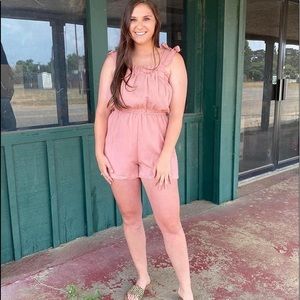 Rose colored romper.